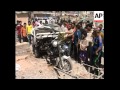 Aftermath of roadside bomb near market in Shiite district that killed 3