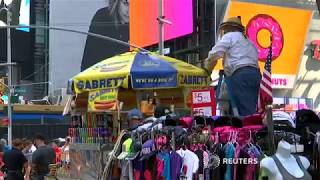 Times Square abuzz as bees swarm hot dog stand