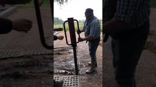 Whacking in a MUDCONTROL 8cm diameter plastic fence post