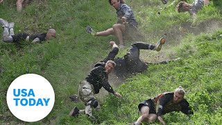 People, cheese roll downhill, wipeout in quirky annual competition | USA TODAY