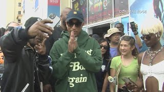 Pharrell makes surprise visit at community event ahead of Something in the Water