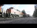 4k 15k stack train and a grain train thru libby montana on bnsf s kootenai river subdivision.