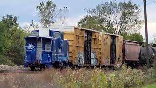 NS northbound with BNSF leaders and a Fracht caboose in Millbury, OH on 10/16/2021