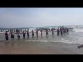 Human chain wades through Lake Michigan