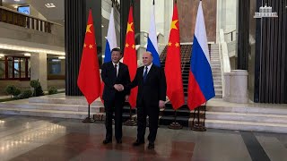 President Xi meets Russian PM ahead of talks with Putin | AFP