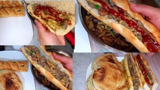 Chicken liver sandwich with fried potatoes in the way of the popular neighborhoods in Algeria