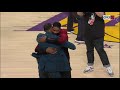 Tristan Thompson and LeBron James hug at halftime of Cavs-Lakers