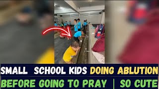 SMALL SCHOOL KIDS ARE MAKING ABLUTION FOR PRAYER !