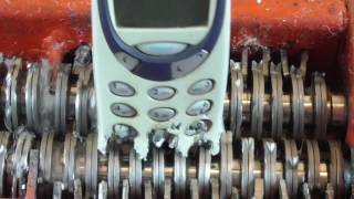 Papper shredder: shredding Nokia 3310 mobile phone