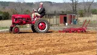 '57 Cub Pulling Spring Tooth Harrow