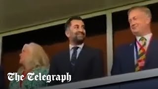 Humza Yousaf smirks as fans boo national anthem