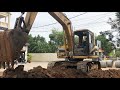 Excavator hard working digging land for put new underground cement pip