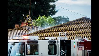 Fire crews battle strong winds while fighting attic fire in Merced