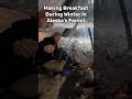 making breakfast during winter camping in alaska