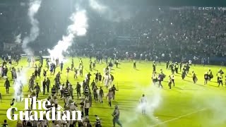 Teargas fired at Indonesian football match, causing crowd crush