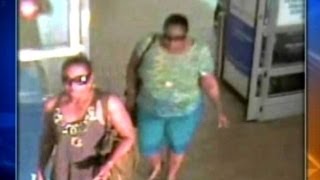 Two women caught on camera taking out dollars in Walmart heist