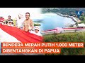 Sambut HUT RI, TNI Bentangkan Bendera Merah Putih 1.000 Meter di Bukit Tungku Wiri Papua