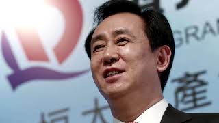 Evergrande boss sells stake to pay debts