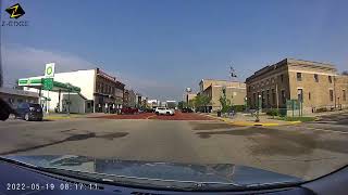 Illegal left turn over double yellow lines into angled parking space