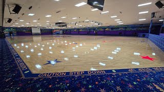 Coating a roller skating rink floor.