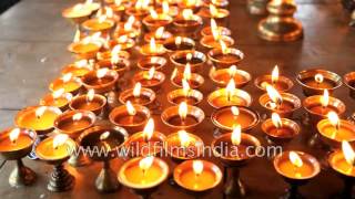 Burning butter lamps at Tawang monastery in Arunachal Pradesh, India