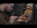 carving a weathered sailor in wood