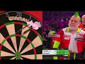 Kirk Bevins shows his disgust at Peter Wright scoring 9