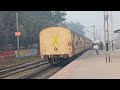 howrah classic icf rajdhani livery wap4 departing with 12333 vibhuti express in foggy morning day.