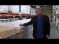 mike adams food warehouse tour revealing the stacked pallets of organic food...