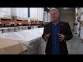 mike adams food warehouse tour revealing the stacked pallets of organic food...