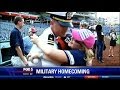 Navy lieutenant returns home early, surprises his children at Nationals Park