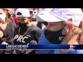 Front-line workers cross Boston Marathon finish line with former champ Des Linden