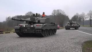 Challenger 2 main battle tanks driving by