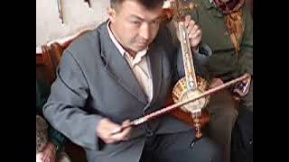 bowed instrument / kamancheh demonstration in Kashgar,  Xinjiang Province