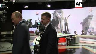 Putin visits Russia Today, news channel funded by Kremlin