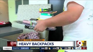 The dangers of your kids' heavy backpacks