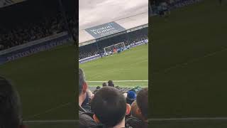 Limbs in the Bolton away end as they score a penalty to go 2-0 up against Peterborough