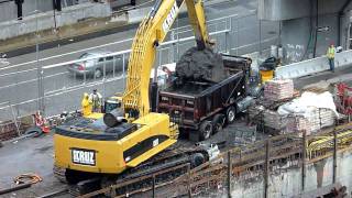 CAT 385C  excavator loading a dump truck [HD]