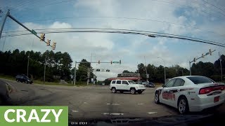 Instant karma: SUV runs red light right in front of police!