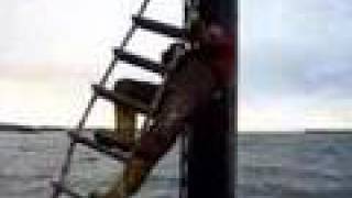 Rope ladder climb to drilling rig