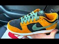 nike dunk low ceramic black orange sneakers on feet