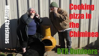 Cooking pizza  in a Chiminea Fire Pit, on Christmas Eve