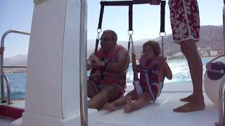 Landing parasailing on boat in Stalida Crete