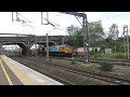 **childrens livery** gbrf 66720 passes lichfield t.v. with the empty car carriers. 16 5 15.