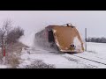 watch snow drifts explode as train crashes through using old illinois central wedge plow