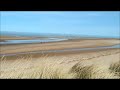 the north norfolk coast dunes sandy beach and sea at burnham overy staithe