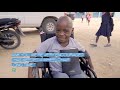 moses receives a wheelchair from wheels for the world