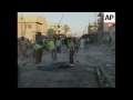 aftermath of two blasts in an outdoor market that killed six