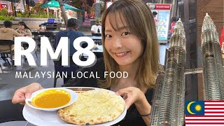 Japanese tried to eat Malaysian local food  near KLCC.