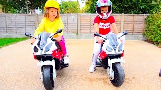 Kids play raicers on Two ride on toy motobikes
